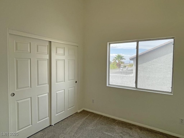 825 Happy Sparrow Ave, Henderson, NV 89052 - unfurnished bedroom with baseboards, carpet floors, and a closet