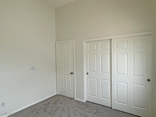 825 Happy Sparrow Ave, Henderson, NV 89052 - unfurnished bedroom with baseboards, carpet flooring, and a closet