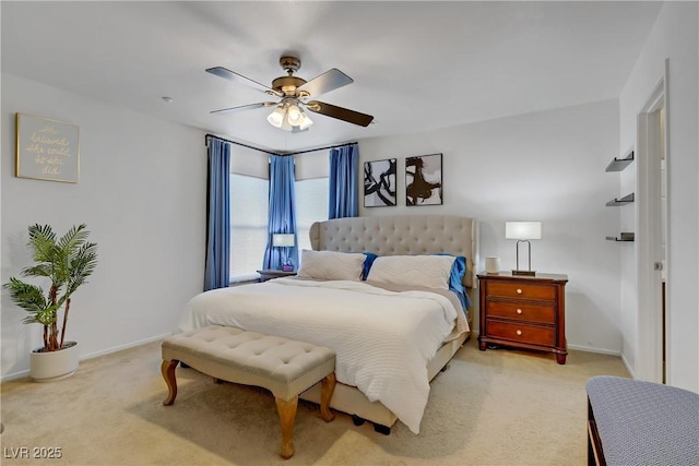 bedroom featuring ceiling fan, light carpet, and baseboards