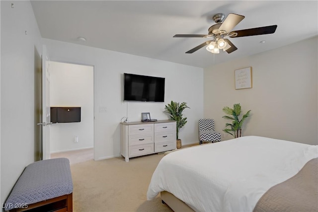 bedroom featuring a ceiling fan, baseboards, and light colored carpet