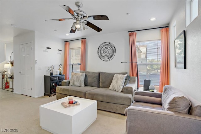 living room featuring light carpet, a ceiling fan, and recessed lighting