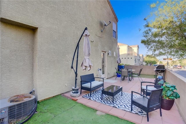 view of patio with fence, outdoor dining area, and area for grilling