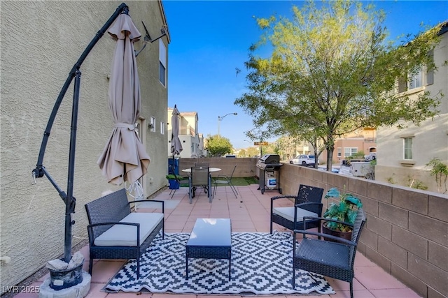 view of patio featuring an outdoor living space, outdoor dining area, grilling area, and a residential view