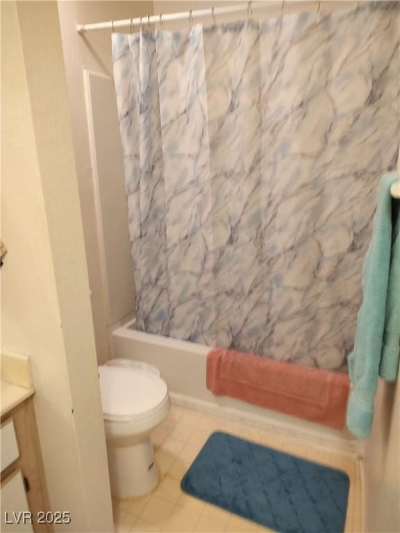 bathroom with toilet, vanity, shower / bath combo, and tile patterned flooring