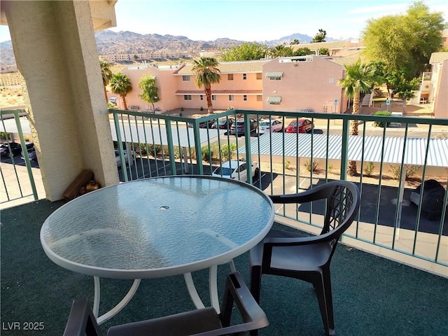 balcony with a residential view and a mountain view