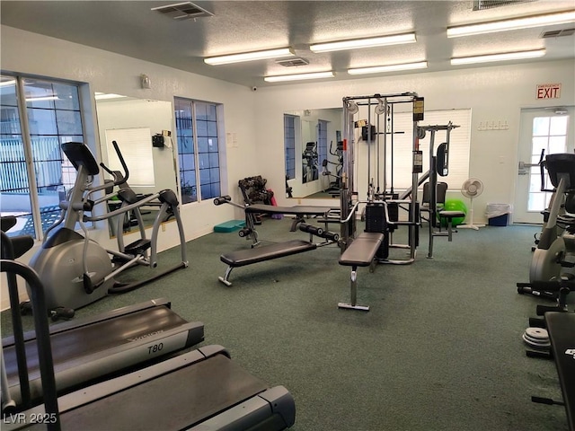 workout area featuring visible vents and baseboards