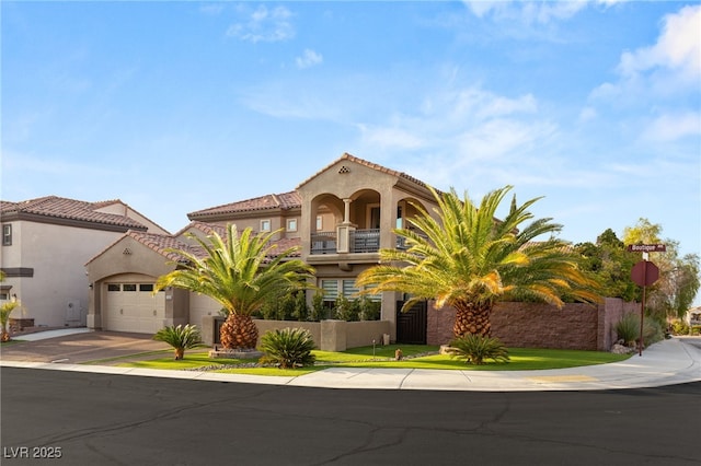 mediterranean / spanish-style home featuring a garage, a tile roof, concrete driveway, and stucco siding