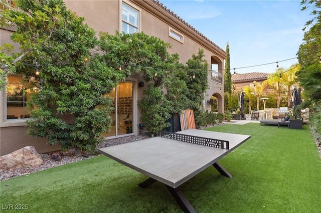 view of yard with a patio and an outdoor living space