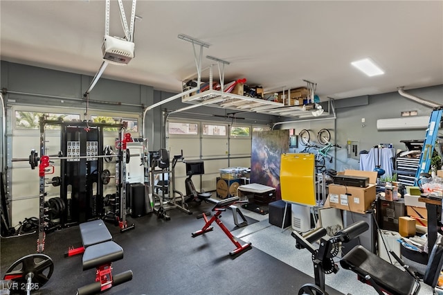 workout area featuring a garage and a wall unit AC