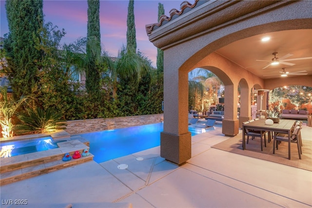 outdoor pool featuring a patio area, outdoor lounge area, outdoor dining space, a ceiling fan, and an in ground hot tub