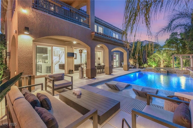 outdoor pool with outdoor lounge area, a patio area, and outdoor dining space