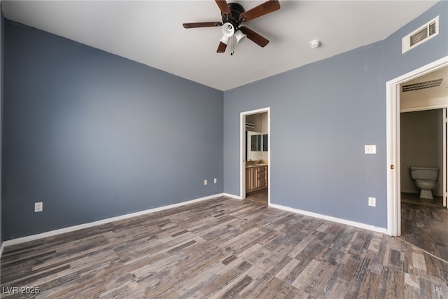 1838 N Jones Blvd, Las Vegas, NV 89108 - unfurnished bedroom with wood finished floors, connected bathroom, baseboards, and ceiling fan