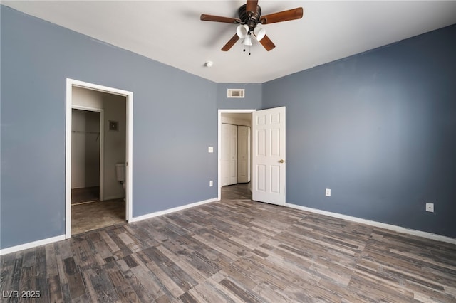 1838 N Jones Blvd, Las Vegas, NV 89108 - unfurnished bedroom with wood finished floors, baseboards, and ceiling fan