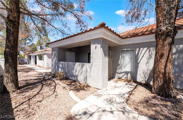 1838 N Jones Blvd, Las Vegas, NV 89108 - view of side of property featuring stucco siding and a tile roof