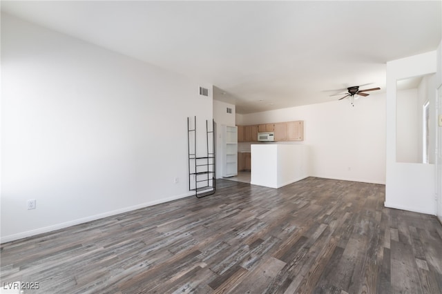 1838 N Jones Blvd, Las Vegas, NV 89108 - unfurnished living room with dark wood-style floors, ceiling fan, and baseboards