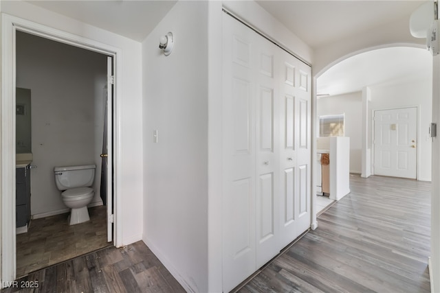 1838 N Jones Blvd, Las Vegas, NV 89108 - hall with arched walkways, wood finished floors, and baseboards