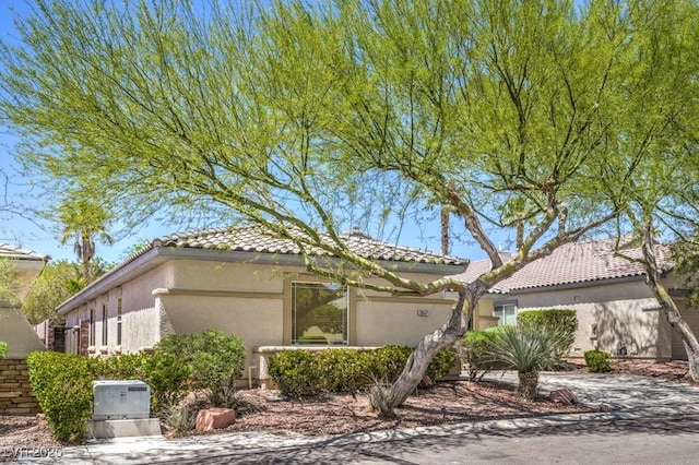 2647 Ivoryhill St, Las Vegas, NV 89135 - view of front of property with a tiled roof and stucco siding