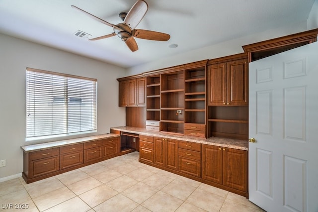 2647 Ivoryhill St, Las Vegas, NV 89135 - unfurnished office featuring built in study area, visible vents, a ceiling fan, and light tile patterned floors