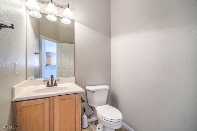 2647 Ivoryhill St, Las Vegas, NV 89135 - bathroom with a textured wall, toilet, and vanity