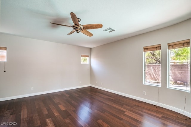 2647 Ivoryhill St, Las Vegas, NV 89135 - empty room featuring a ceiling fan, dark wood-type flooring, and plenty of natural light