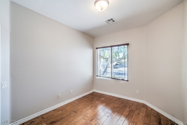 2647 Ivoryhill St, Las Vegas, NV 89135 - unfurnished room with baseboards, hardwood / wood-style flooring, and visible vents
