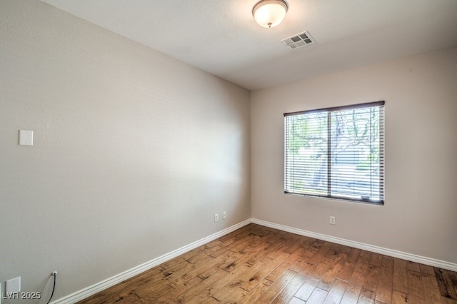 2647 Ivoryhill St, Las Vegas, NV 89135 - spare room featuring hardwood / wood-style flooring, visible vents, and baseboards