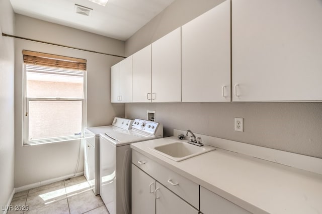 2647 Ivoryhill St, Las Vegas, NV 89135 - clothes washing area featuring washing machine and dryer, plenty of natural light, a sink, and cabinet space