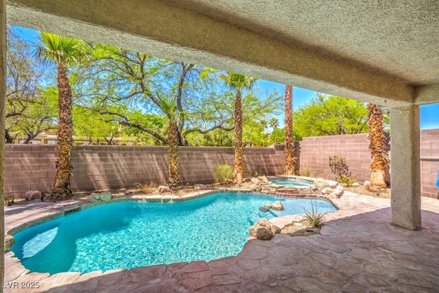 2647 Ivoryhill St, Las Vegas, NV 89135 - view of swimming pool featuring a fenced backyard, a patio area, a fenced in pool, and an in ground hot tub