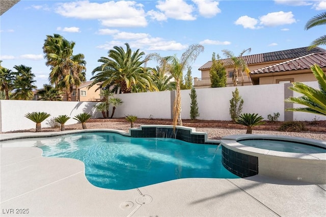 view of swimming pool with a fenced backyard, a fenced in pool, and an in ground hot tub