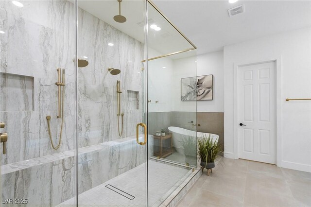 bathroom with visible vents and a marble finish shower