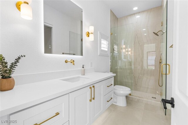 full bathroom featuring tile patterned floors, a marble finish shower, vanity, toilet, and recessed lighting