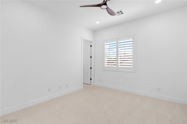 carpeted spare room featuring baseboards, visible vents, recessed lighting, and ceiling fan