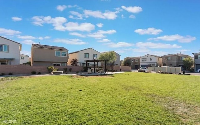 view of yard with a gazebo, fence, a residential view, and a patio area