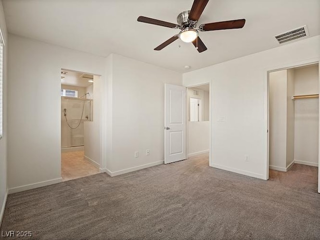 unfurnished bedroom featuring visible vents, connected bathroom, carpet flooring, and baseboards