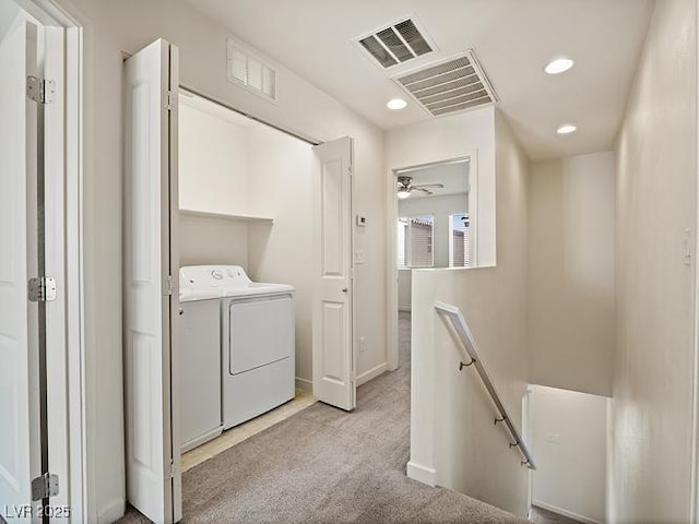laundry area with visible vents, light carpet, independent washer and dryer, and laundry area