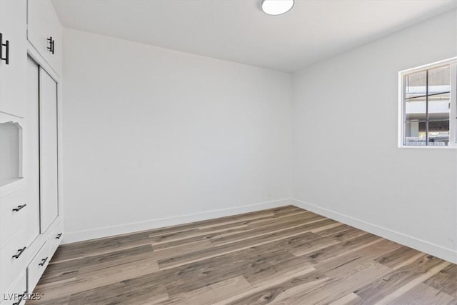 429 N 10th St, Las Vegas, NV 89101 - spare room featuring light wood-style floors and baseboards