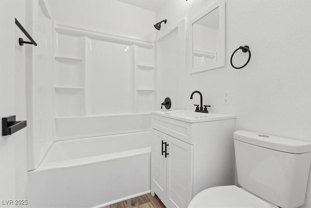 429 N 10th St, Las Vegas, NV 89101 - bathroom featuring toilet, vanity, shower / washtub combination, and wood finished floors