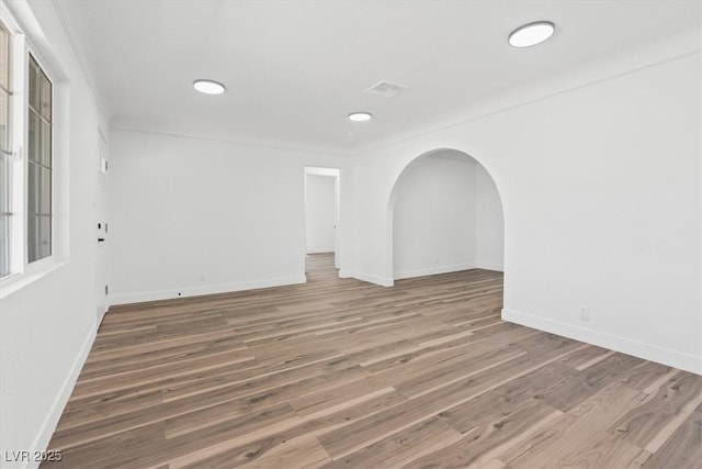 429 N 10th St, Las Vegas, NV 89101 - unfurnished room featuring baseboards, wood finished floors, recessed lighting, and arched walkways