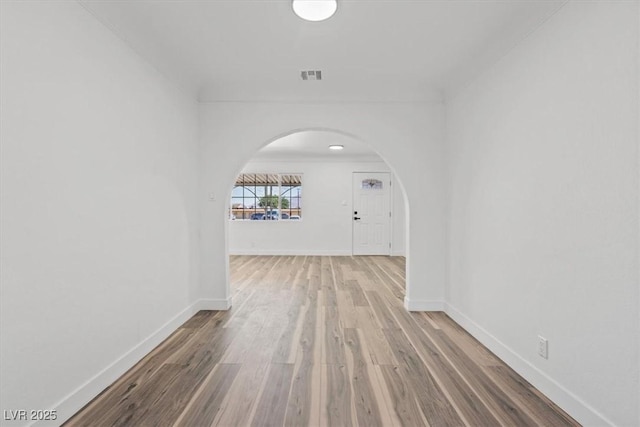 429 N 10th St, Las Vegas, NV 89101 - hallway with arched walkways, wood finished floors, and baseboards