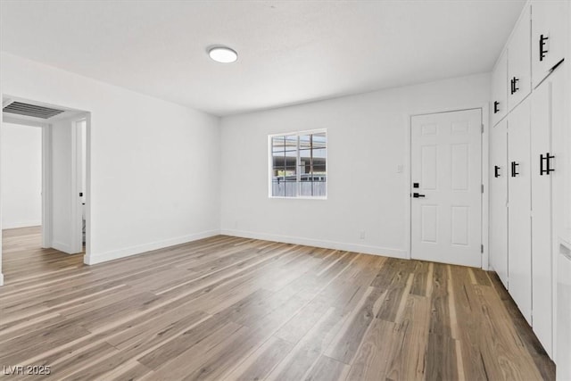 429 N 10th St, Las Vegas, NV 89101 - unfurnished room with light wood finished floors and baseboards