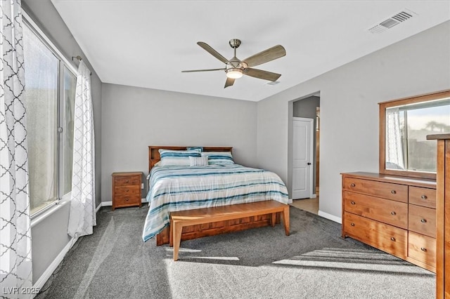 bedroom with carpet, visible vents, a ceiling fan, and baseboards