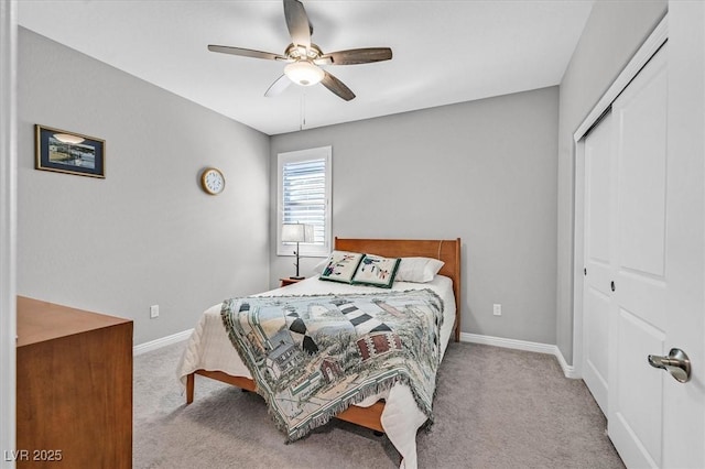 bedroom featuring baseboards, a closet, and carpet