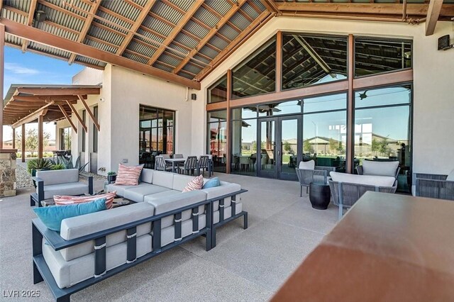 view of patio / terrace with outdoor dining space and an outdoor hangout area