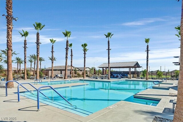 community pool featuring fence, a patio area, and a gazebo