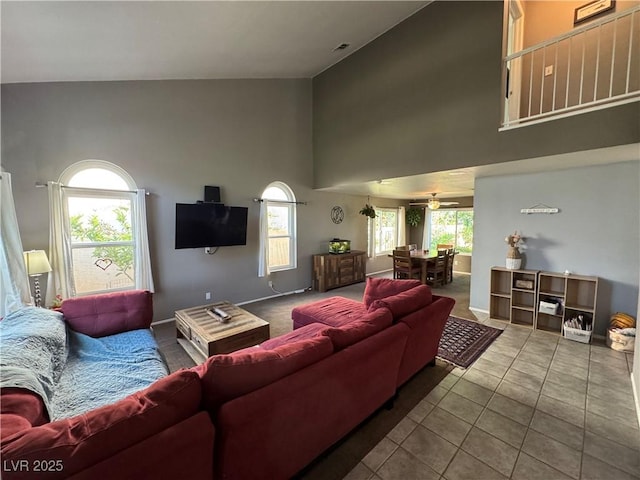 2807 Camelback Ln, Henderson, NV 89074 - tiled living area with baseboards, high vaulted ceiling, and a ceiling fan