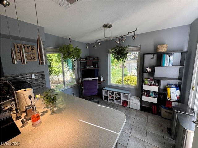 2807 Camelback Ln, Henderson, NV 89074 - kitchen with a textured ceiling, tile patterned floors, visible vents, and plenty of natural light