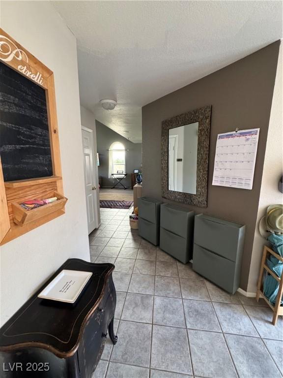 2807 Camelback Ln, Henderson, NV 89074 - hallway with a textured ceiling and light tile patterned floors