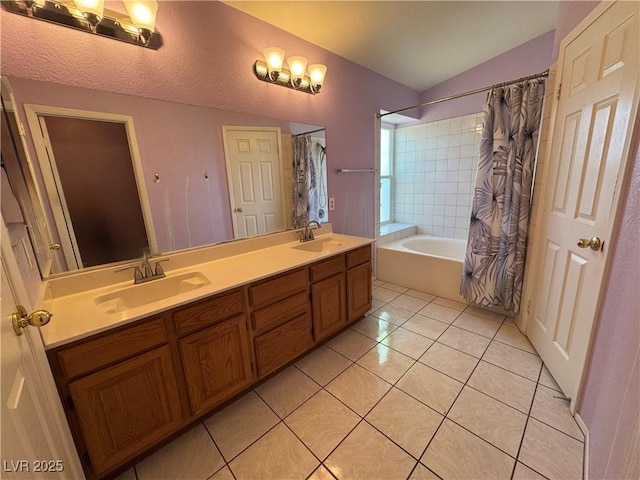 2807 Camelback Ln, Henderson, NV 89074 - full bath with double vanity, tile patterned flooring, lofted ceiling, and a sink