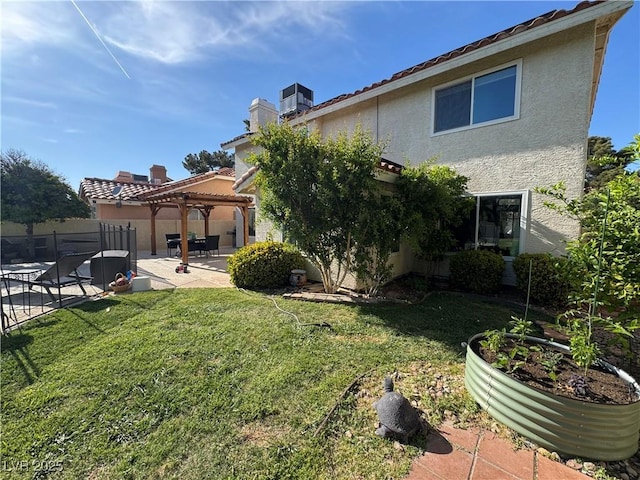 2807 Camelback Ln, Henderson, NV 89074 - rear view of property featuring a patio area, fence, a yard, stucco siding, and a pergola