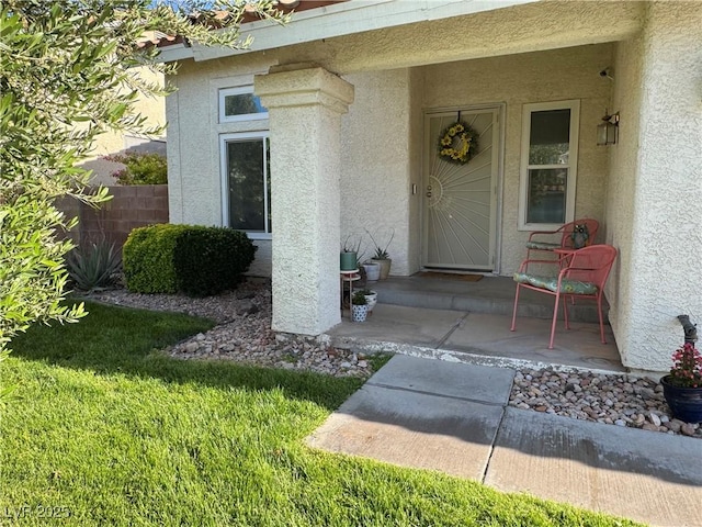 2807 Camelback Ln, Henderson, NV 89074 - doorway to property featuring fence and stucco siding